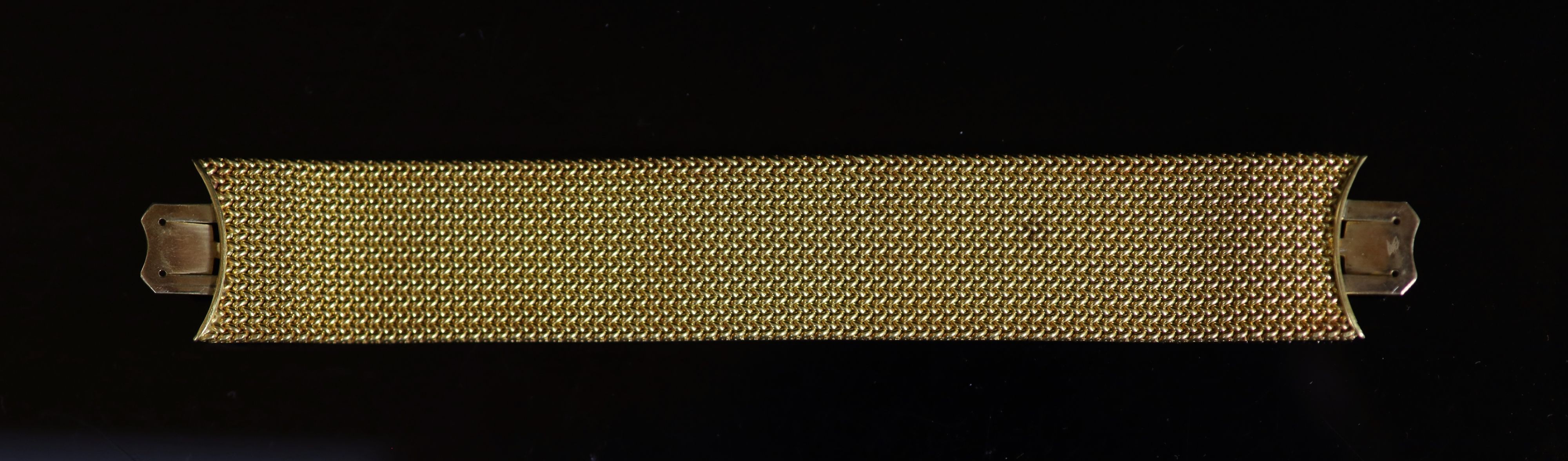 A Victorian gold mesh link bracelet section, lacking central motif